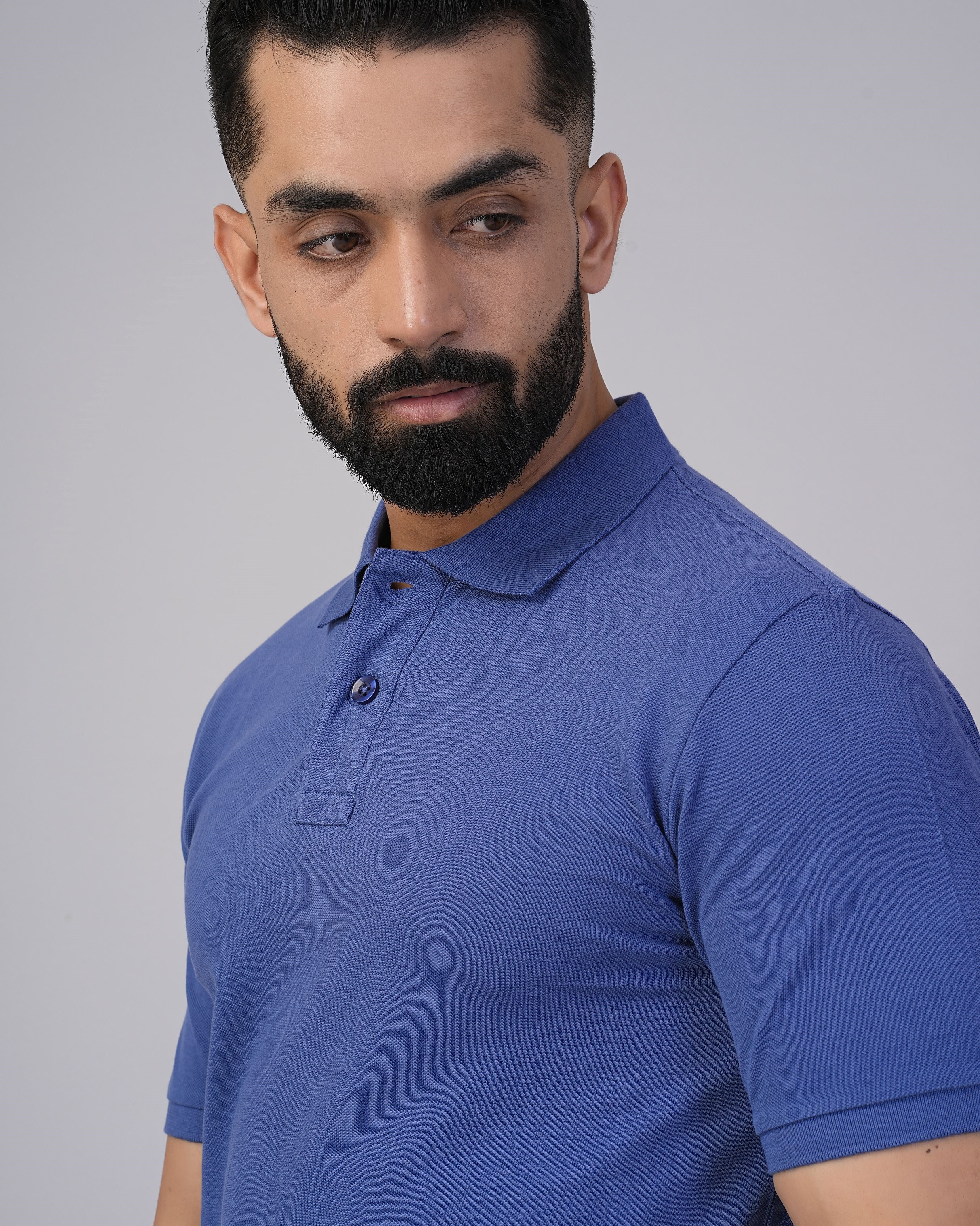 Men's black polo neck t-shirt made from 100% super combed cotton pique knit fabric, showcasing a stylish and comfortable fit.